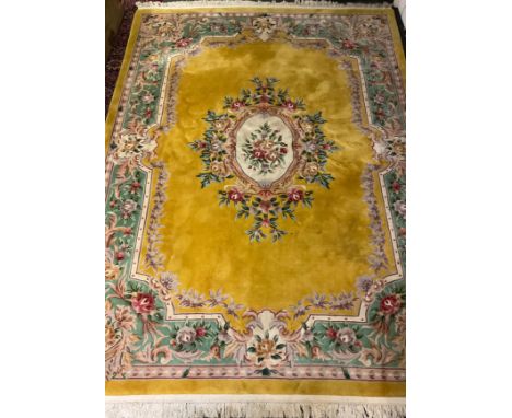 A large Chinese floral carpet, yellow ground, 374cm x 278cm. 