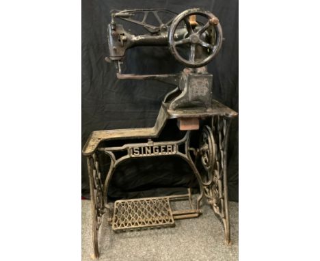 A Singer 29 K 15 cobblers treadle sewing machine, cast iron body, indistinct serial no, 110cm high, 69cm long 