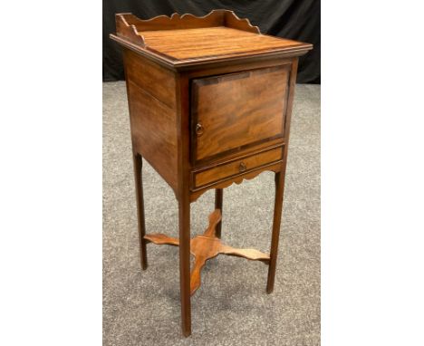 A 19th century walnut and mahogany pot stand, three quarter galleried top, over a cupboard and small drawer, square legs with