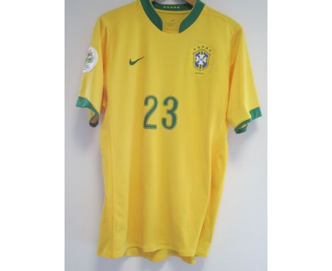 ROBINHO BRAZIL SHIRT     A yellow short sleeve player issue Brazil shirt with 23 Robinho on the back and Germany 2006 World C