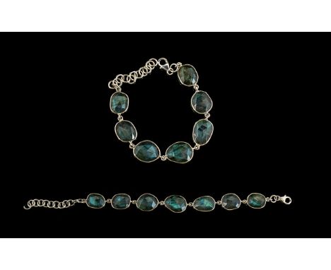 Labradorite Bracelet, comprising seven ovoid labradorites with excellent displays of schiller, the green/blue inner light equ