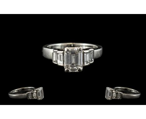 Ladies Platinum - Attractive Contemporary Designed Emerald Cut Diamond Set Dress Ring, The Central Step Cut Diamond of Excell