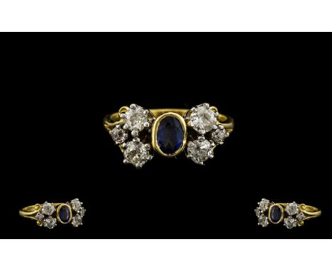 18ct Gold - Attractive 1930's Sapphire and Diamond Dress Ring of Pleasing Design. Full Hallmark for 18ct. The Central Sapphir