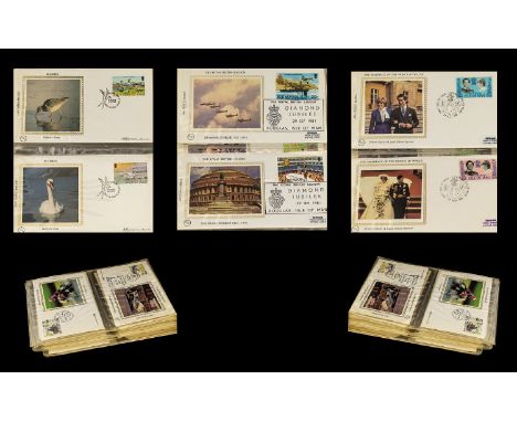 Small Blue Album Of Isle Of Man Benham Silk Containing Around 60 First Day Covers. To include birds, hobbies, royalty, buildi