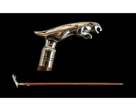 A Walking Stick with a polished chrome Jaguar mascot screw off top. Please see accompanying image.