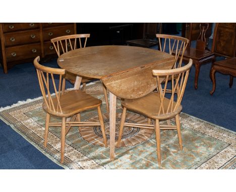 Ercol Table &amp; Four Chairs.  Chairs cross-banded style.  Table has two side extenders, needs re-polishing,  Table height 2