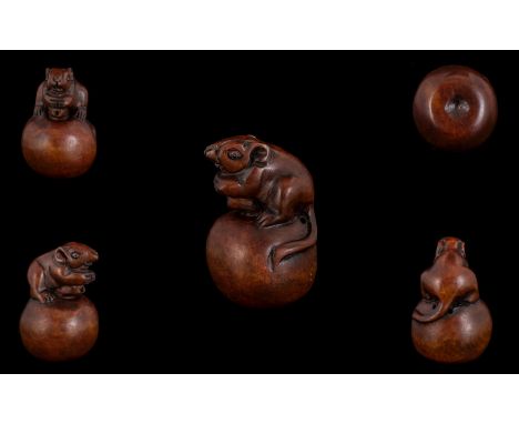 Japanese 19th Century Carved Boxwood Netsuke, Depicts a Small Field Mouse Perched on Top of a Large Nut. Good Patina. 2.5 Inc
