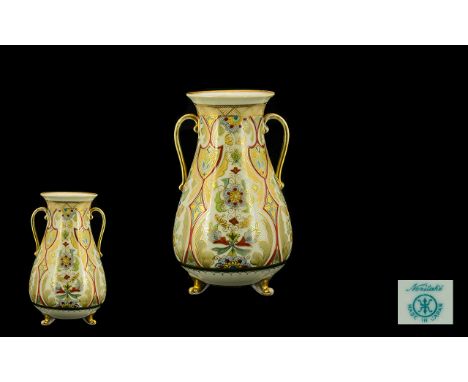 Noritake Twin Handle Footed Vase Of waisted baluster form, turquoise factory stamp to base, raised on tripod feet with twin c