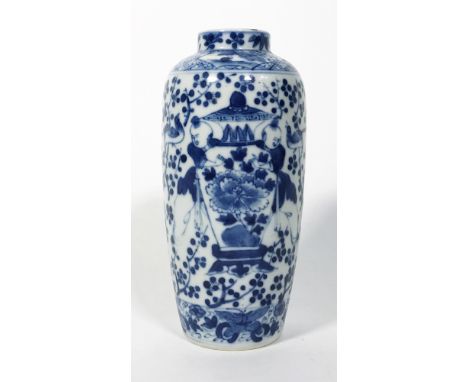 painted with children holding a large vase, chip, pseudo Kangxi mark,   18,5cm high   