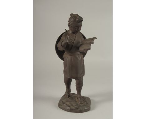 A FINE JAPANESE BRONZE OKIMONO OF A BOY HOLDING A BOOK, signed to the reverse, 31cm high.