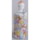 A 20TH CENTURY CHINESE FAMILLE ROSE PORCELAIN SNUFF BOTTLE, painted with boys, base with character