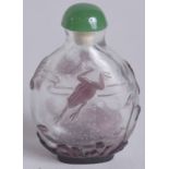 A 19TH CENTURY CHINESE PEKING GLASS SNUFF BOTTLE, decorated with frogs, 6.5cm high.