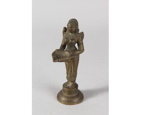 AN INDIAN BRONZE DEITY FIGURAL OIL LAMP, 15cm high.