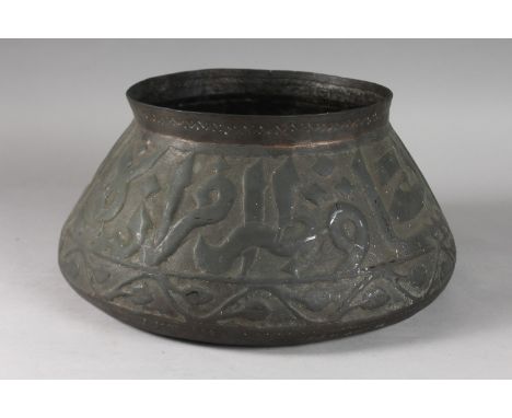 AN ISLAMIC METAL BOWL WITH LARGE CALLIGRAPHY, 35cm diameter.