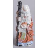 A 20TH CENTURY CHINESE SHAO LAO FIGURAL PORCELAIN SNUFF BOTTLE, 9cm high.