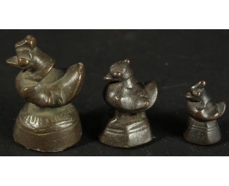 THREE BURMESE GRADUATED BRONZE OPIUM WEIGHTS, (3).