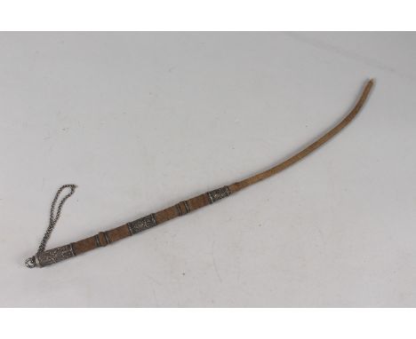 A 19TH CENTURY INDIAN WHIP, mounted with engraved silver bands, 52cm long.