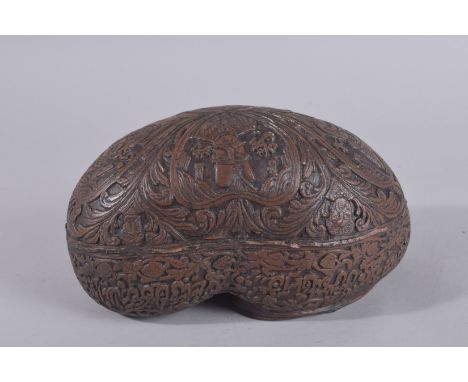 AN EARLY 20TH CENTURY KASHKOOL, with portraits and calligraphy, 25cm long.