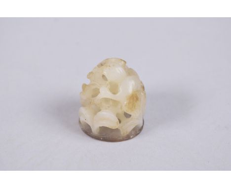 A VERY FINE 19TH CENTURY CHINESE JADE CARVING, depicting cranes and openwork foliage, 3cm high.