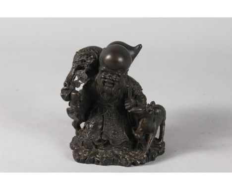 A BRONZE FIGURE OF SHOU LAO WITH DEER, 12cm high.