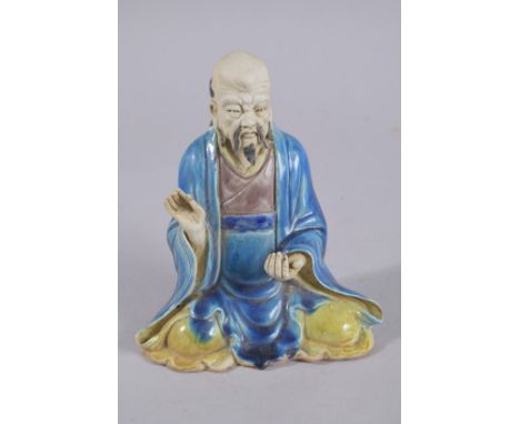 A CHINESE FAHUA STYLE GLAZED POTTERY FIGURE, 18cm high.