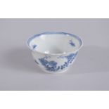 AN 18TH CENTURY CHINESE BLUE AND WHITE PORCELAIN TEA CUP, painted with flora, mark to base, 8.5cm