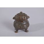 AN UNUSUAL BRONZE MINIATURE LIDDED CENSER, 5.5cm high.