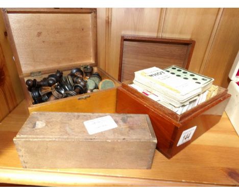 A box of old chess men. box of dominoes and box of playing cards