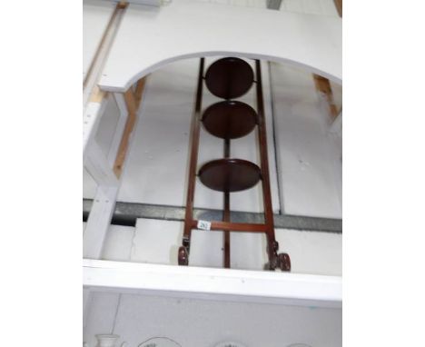 A mahogany folding triple shelf cake stand