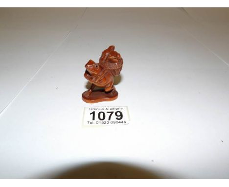 A Chinese boxwood netsuke