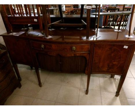 A mahogany inlaid bow front sideboard on tapered legs