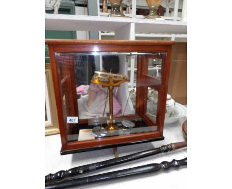 A cased set of apothecary scales
