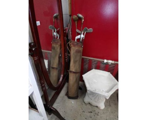 A vintage golf bag and clubs