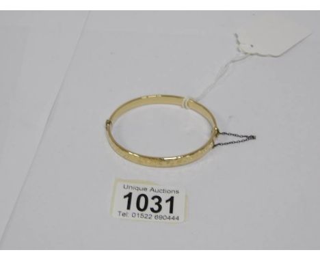A 9ct gold bangle, 9gms