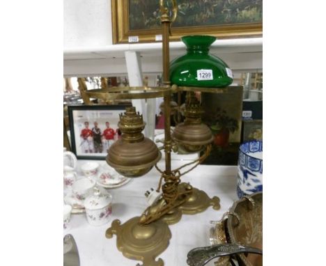 A brass adjustable double student oil lamp converted to electric (missing chimneys and one shade)