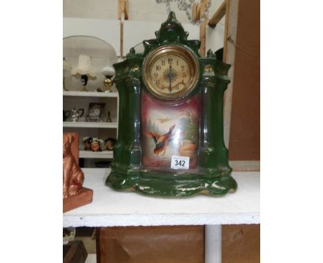 A Victorian ceramic mantel clock