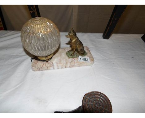 A French marble based table lamp with spelter dog and glass globe shade