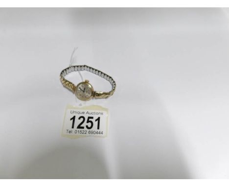 A 9ct gold Rotary 21 jewel wrist watch on  yellow metal strap