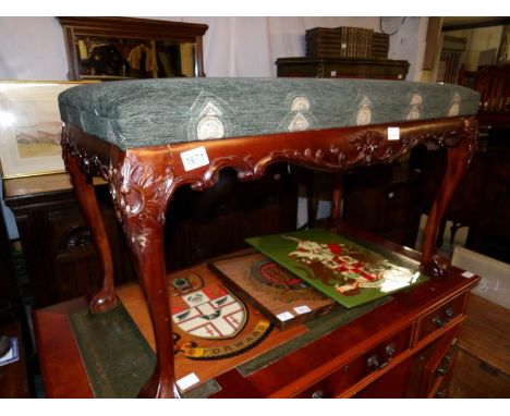 A reproduction mahogany duet stool