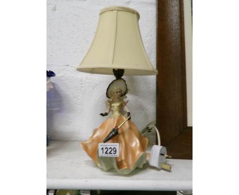 An Italian figurine as a table lamp with shade