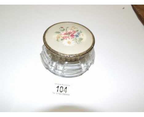 A powder bowl with tapestry lid