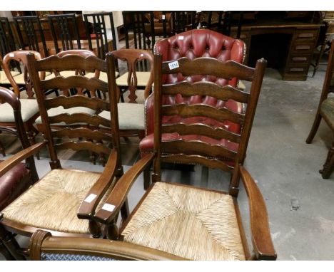 A pair of ladder back carver chairs
