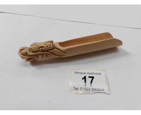 A Chinese 'netsuke' dragon spoon