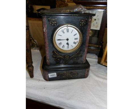 A black marble mantel clock