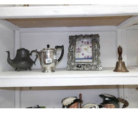 A Silver plate teapot, pewter teapot, brass bell and photo frame