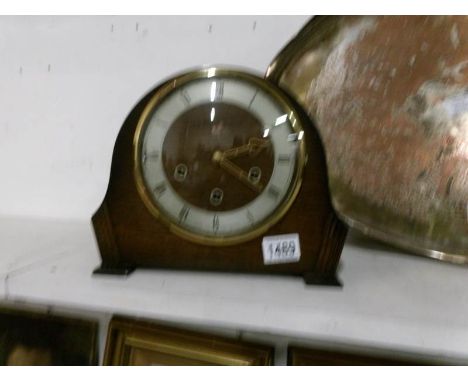 An oak mantel clock