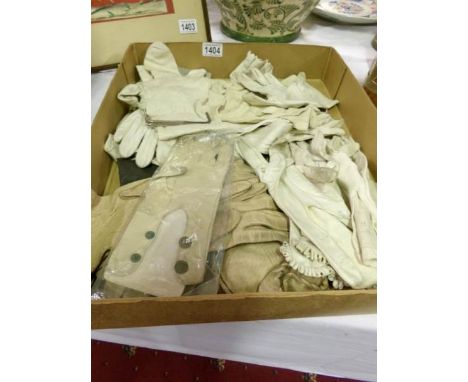 A quantity of vintage leather and kid gloves and an unusual 'stocking' purse