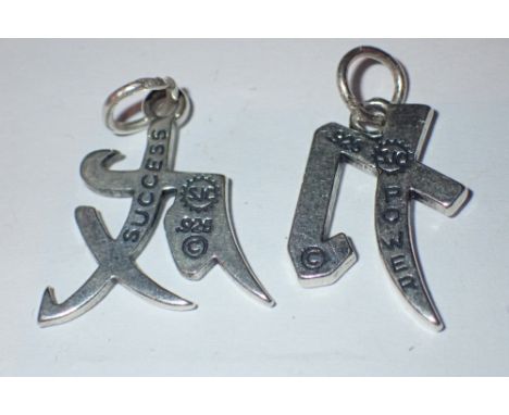 Two solid silver Chinese symbol pendants success and power 