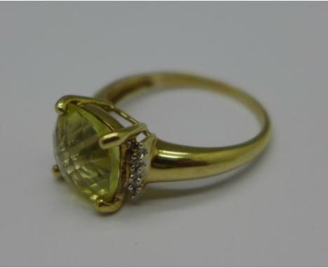 A 9ct gold, diamond and yellow stone ring, 3.0g, R