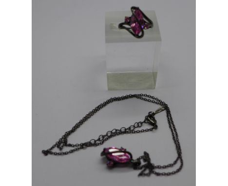 A laboratory created 10k black gold filled pendant and chain and a matching pink sapphire stone set ring, 2.5ct weight, N